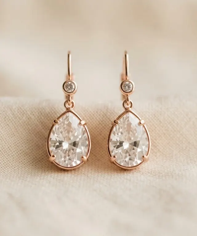 Teardrop crystal earrings with rose gold-tone settings